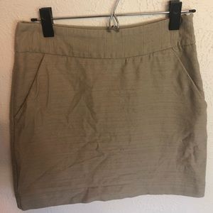 Taupe cotton skirt with polyester lining.